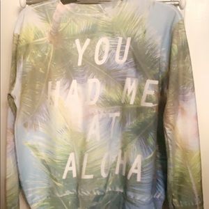 A graphic sweatshirt “You Had Me At Aloha”